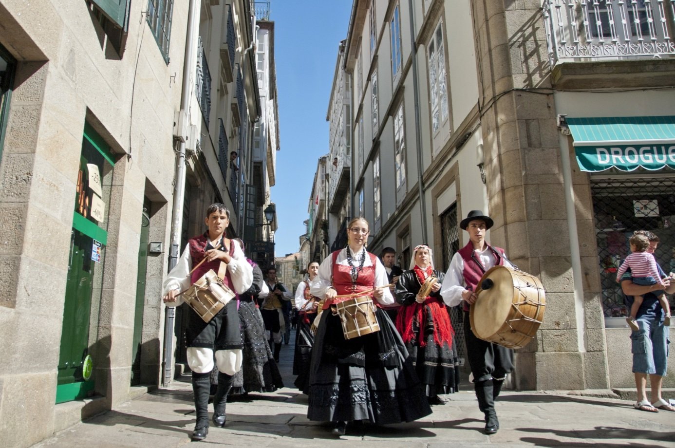 Galician musicians march to traditional music on Santiago's street in honor of Saint James Day on July 25 Camino Uwalk